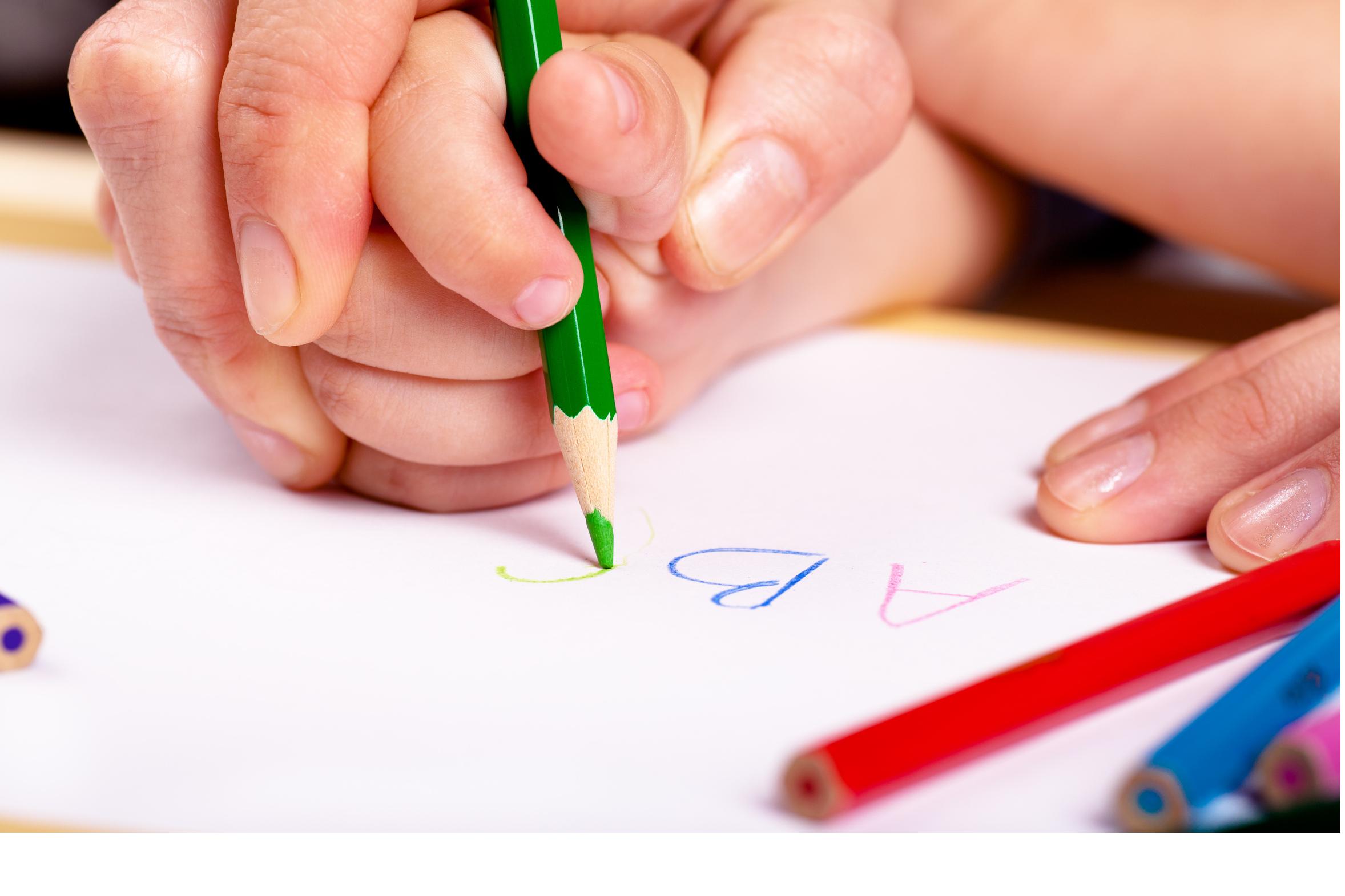 hand-over-hand-writing-building-blocks-occupational-therapy